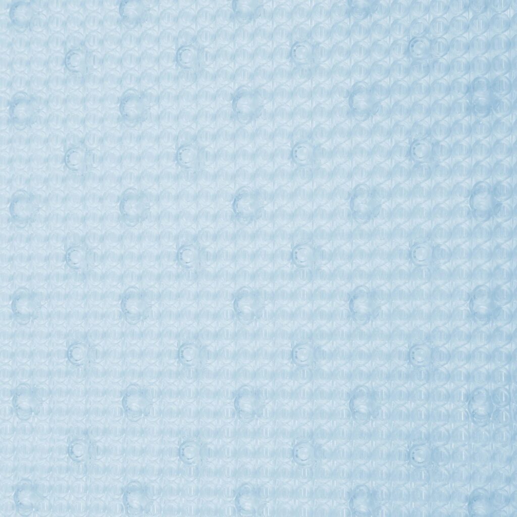 Pale blue bath and shower rubber mat texture with bubbled effect