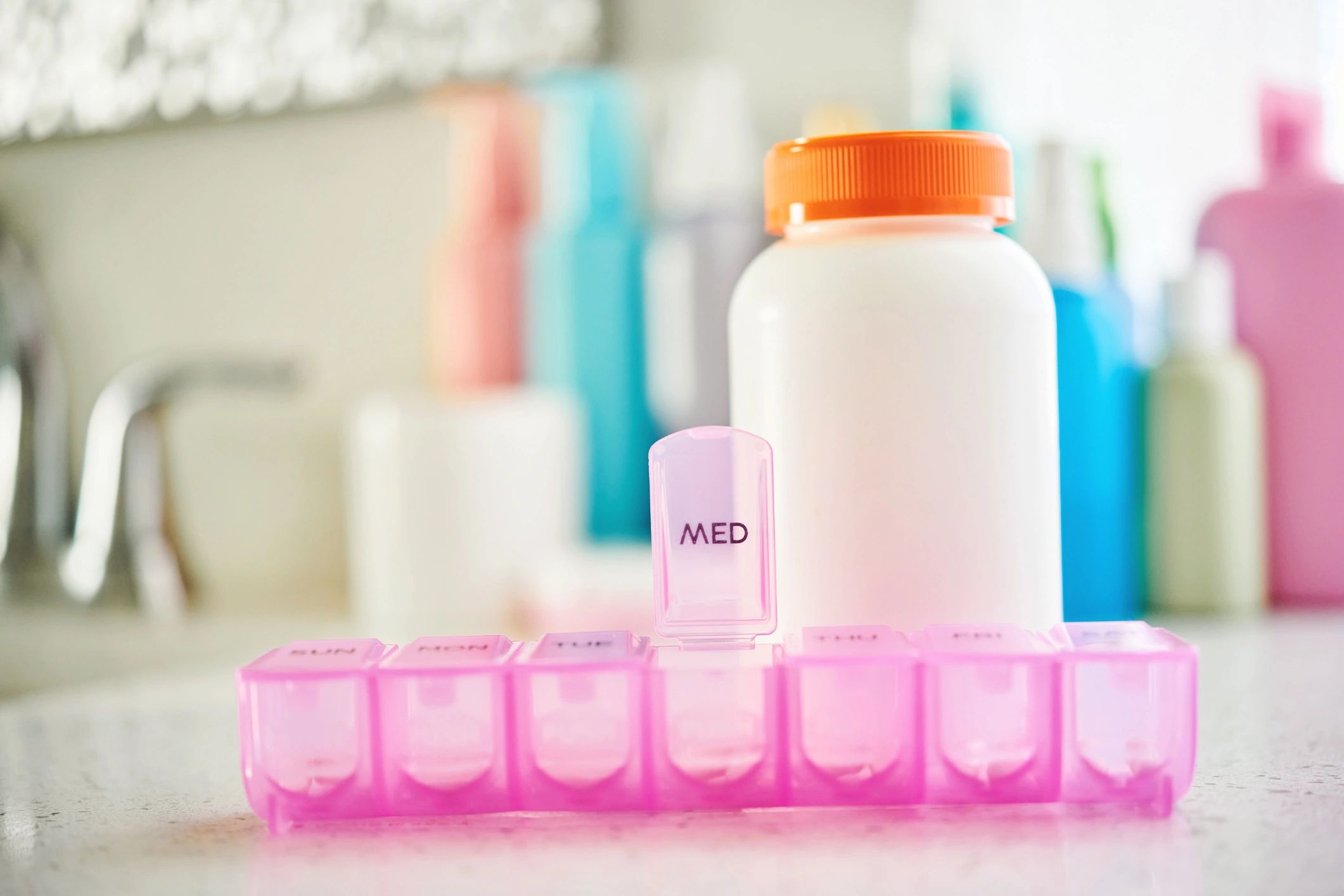 Vitamin bottles and personal care items used for daily routines