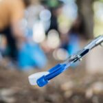 Reacher grabber tool used to pick up items without bending or climbing