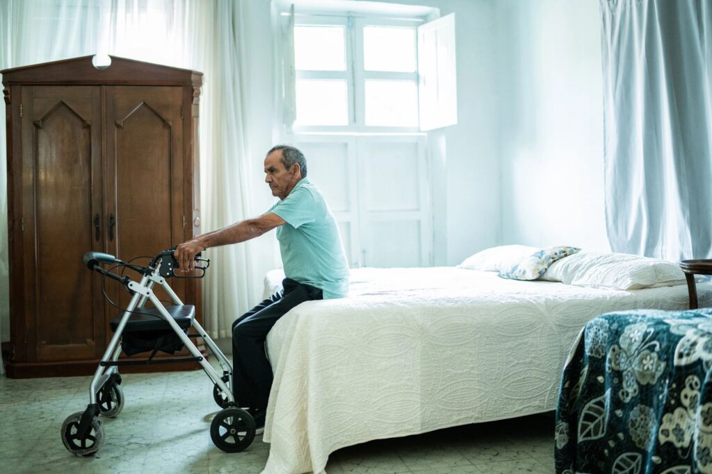 Senior man with a mobility walker at home