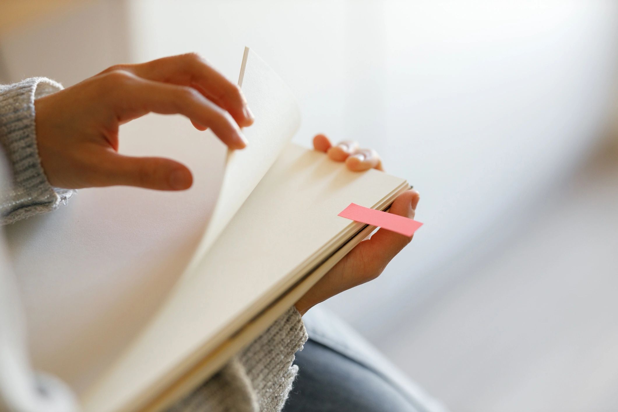 Notepad with colorful page markers representing reminders