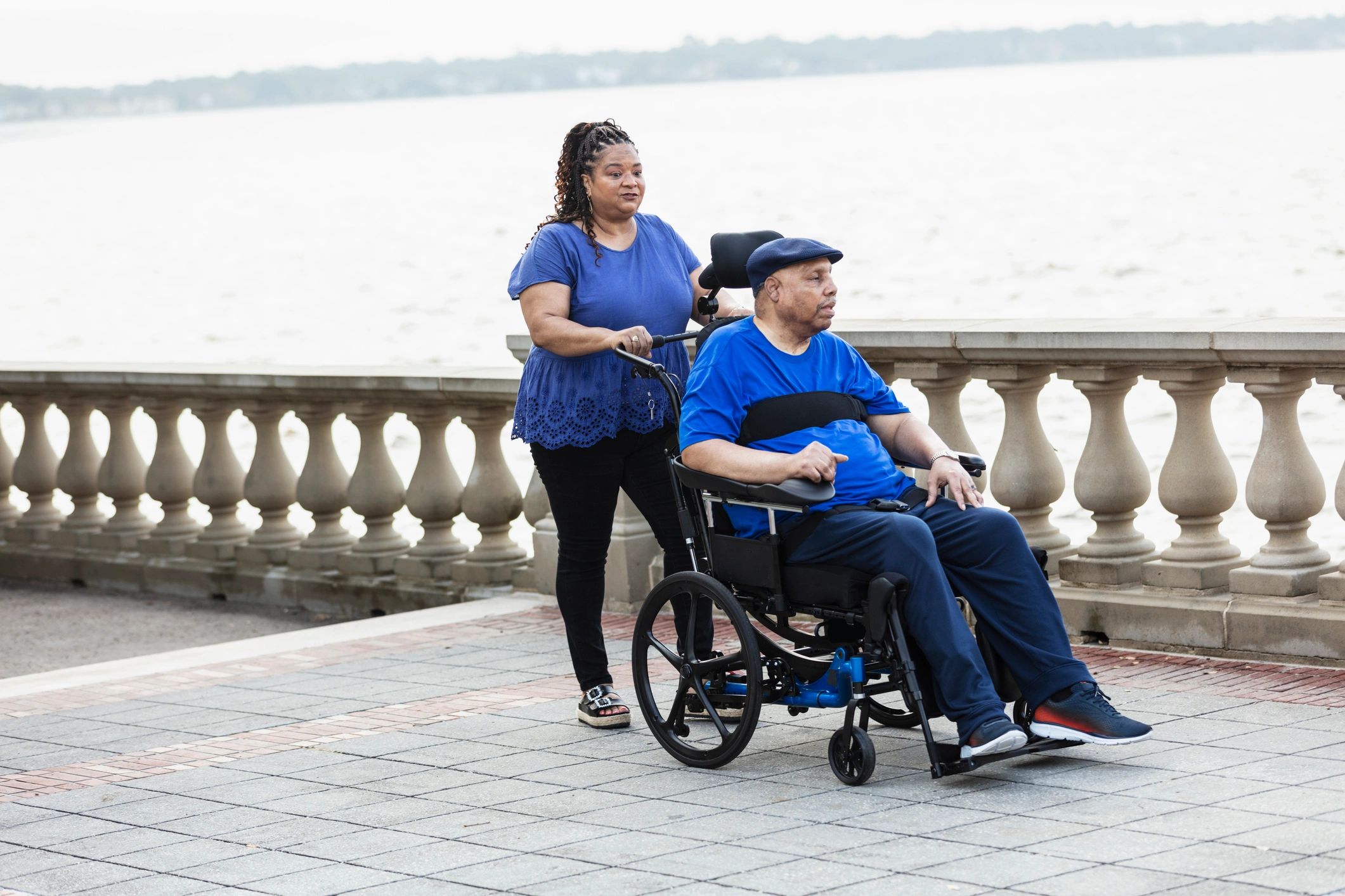 Older adult using a wheelchair outdoors