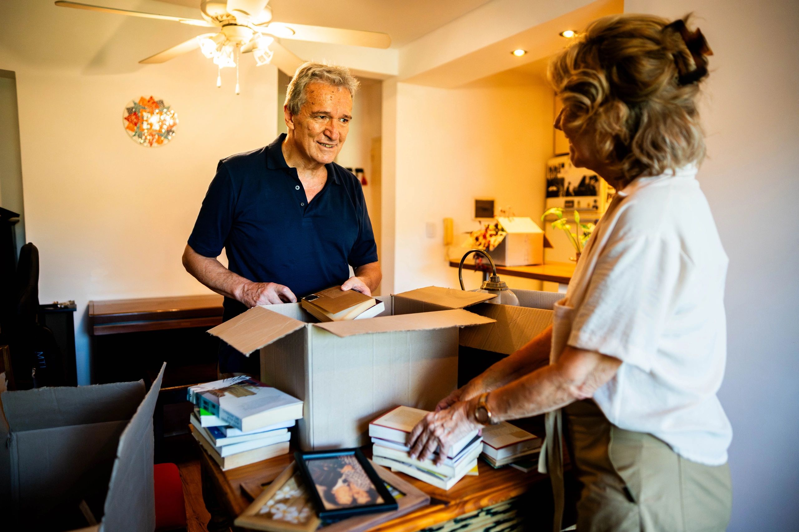 Senior couple organizing items at home
