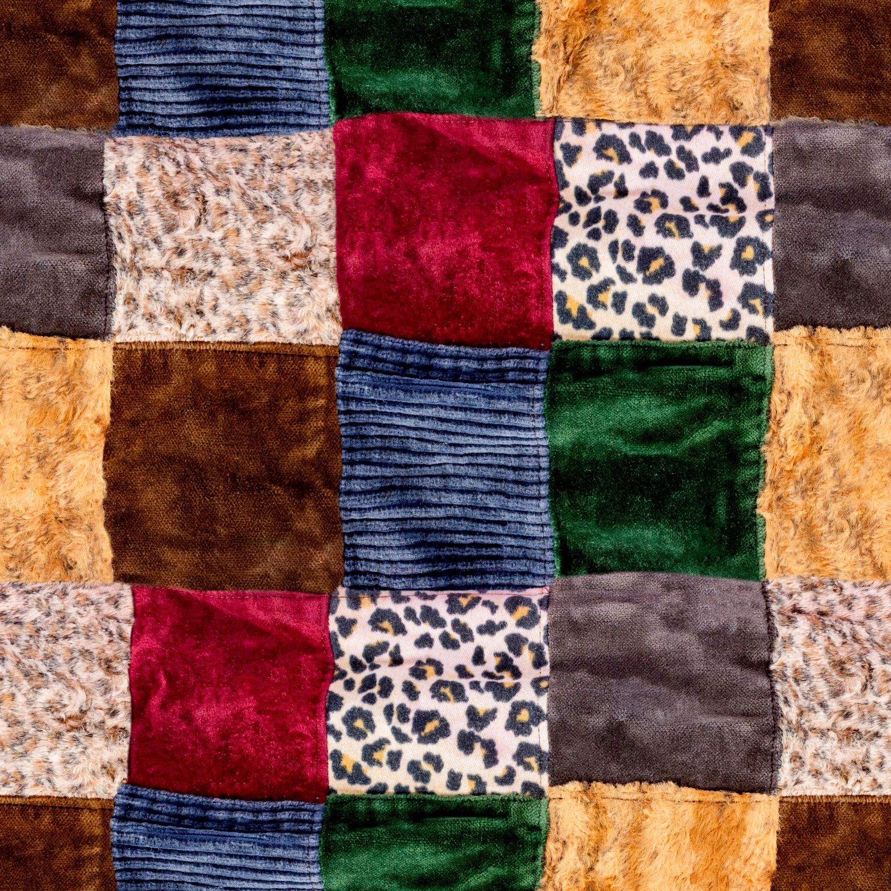 Fidget blanket with textured patches for sensory engagement