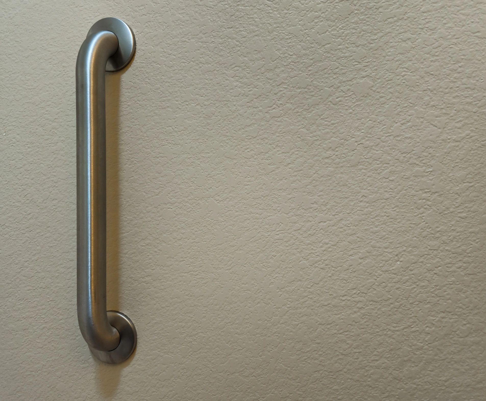 Wall-mounted grab bar for bathroom safety