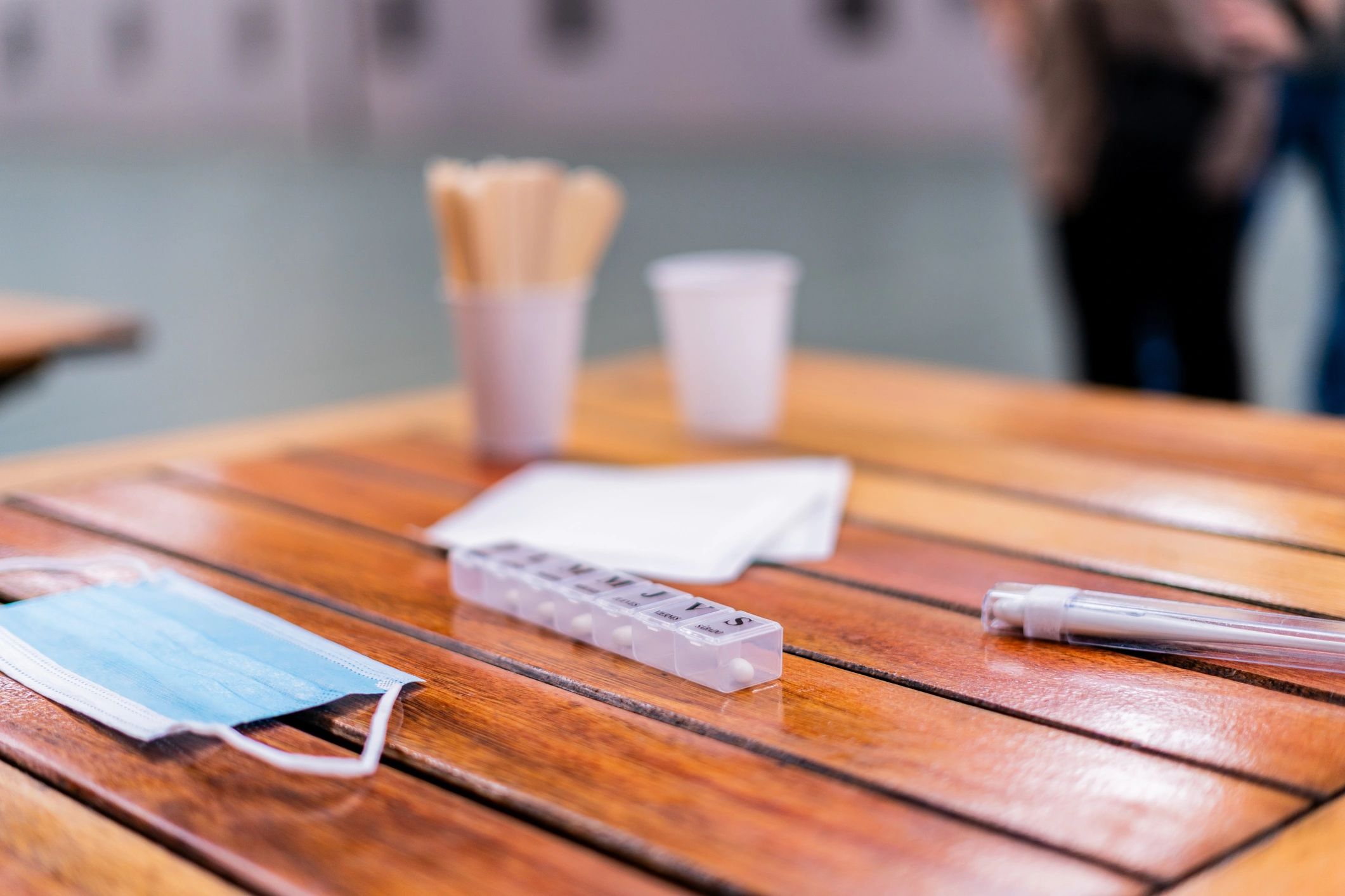 Close-up of pill organizer on table